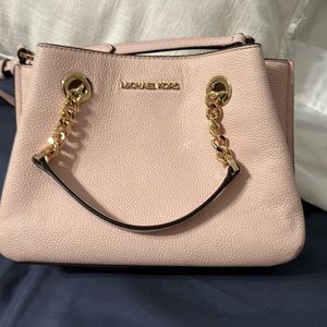 Used small soft pink MK purse